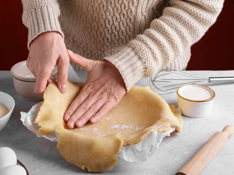 Stretching the Dough Into the Pie Dish